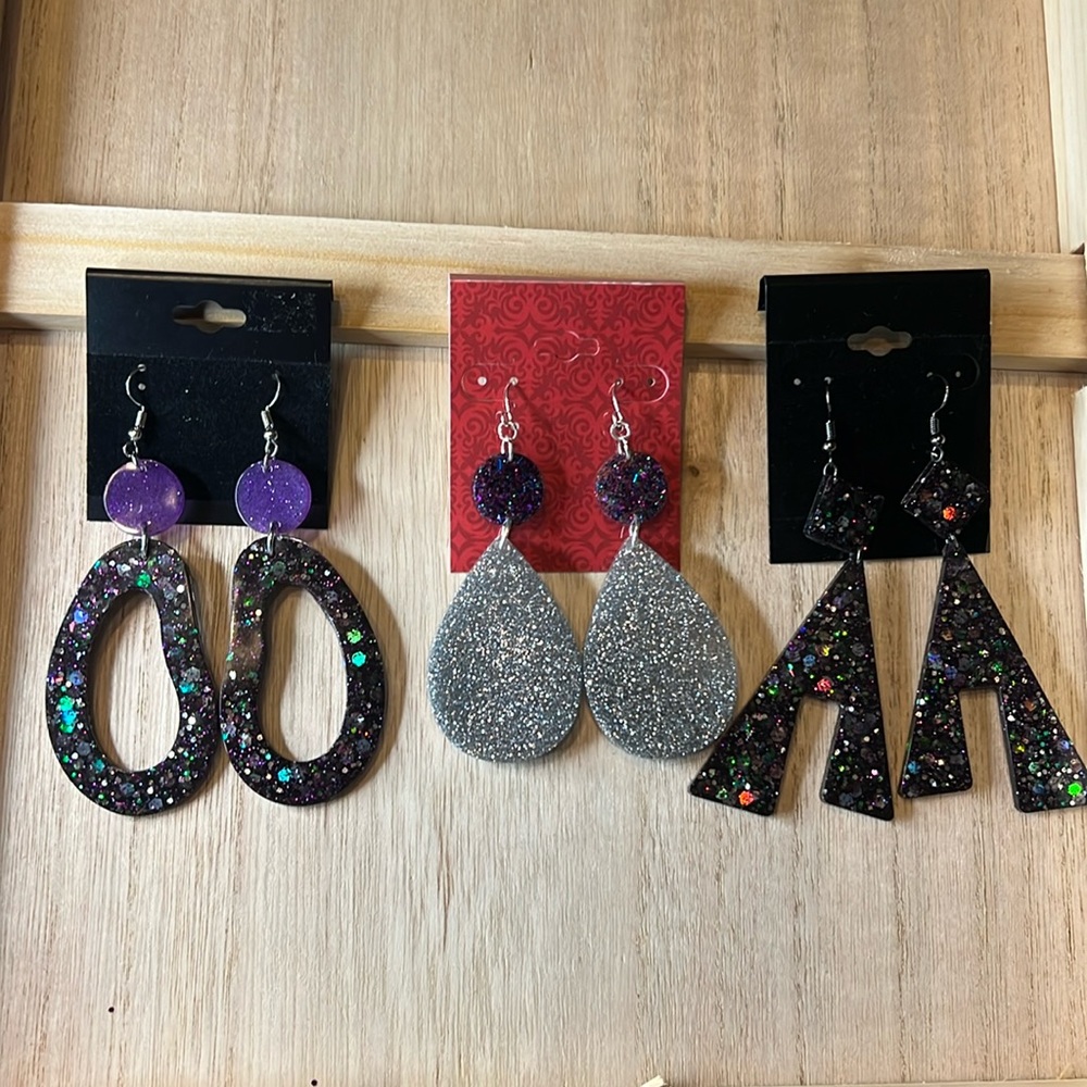Three pairs of dangle earrings